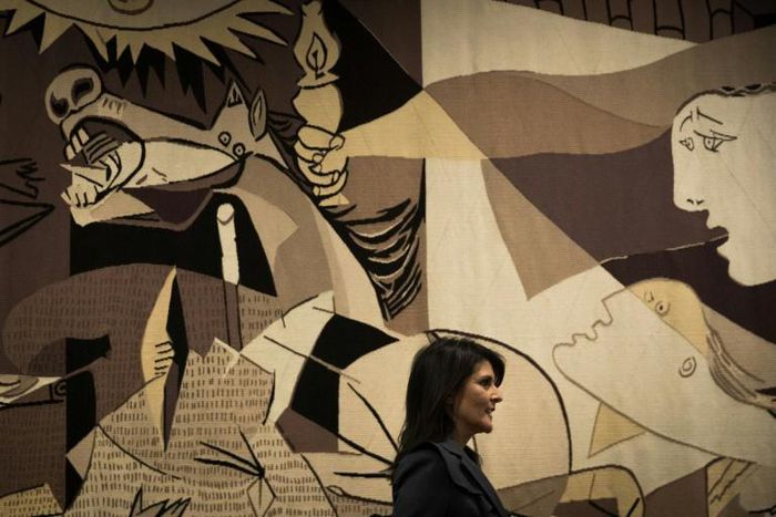 Then-US ambassador to the United Nations Nikki Haley walks past a replica of "Guernica" by Pablo Picasso at the UN headquarters in January 2018