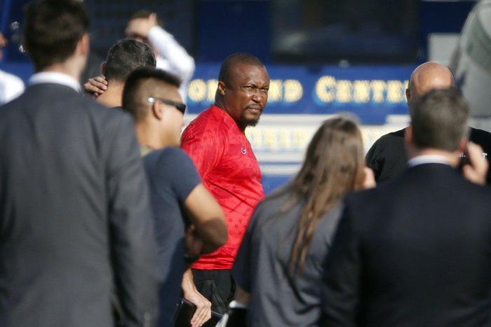 U.S. federal agents hold a detainee, center, at a downtown Los Angeles parking lot after predawn raids that saw dozens of people arrested in the L.A. area Thursday, Aug. 22, 2019 [AP Photo/Reed Saxon]
