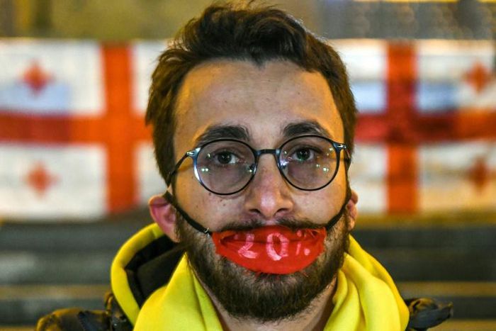 A Georgian opposition supporter attend a rally outside the parliament in central Tbilisi on November 14, 2019