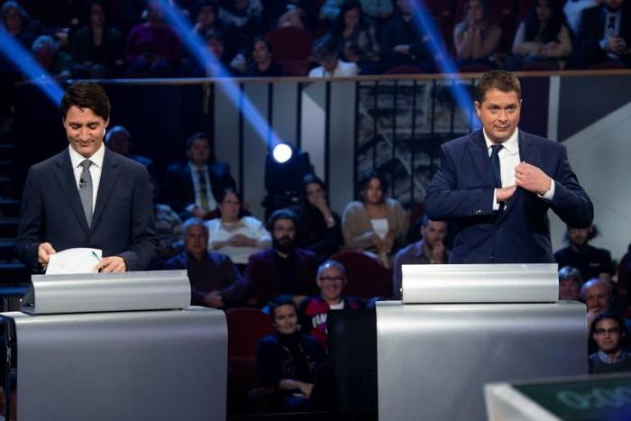 Canada's Prime Minister and Liberal leader Justin Trudeau (L) and Conservative leader Andrew Scheer take part in an election debate on October 10, 2019