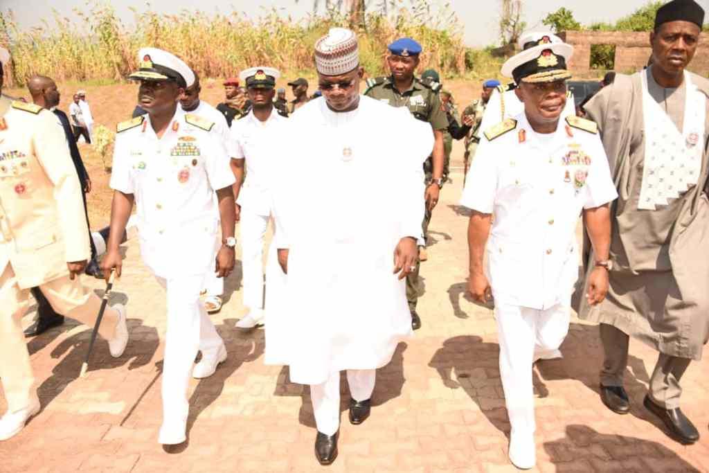 The Chief of the Naval Staff Vice Admiral Ibok- Ete Ibas ushering Governor Yahaya Bello of Kogi State to the commissioning of the Naval Base in Banda- Lokoja (NN)