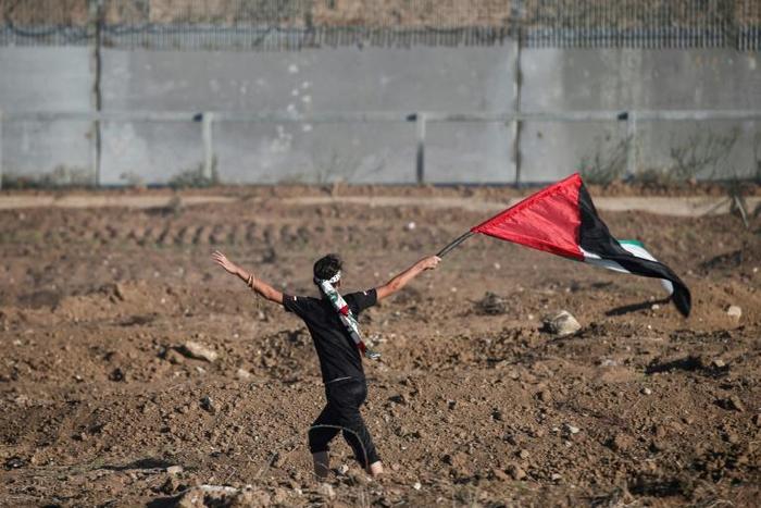The Palestinian Authority will receive a transfer of 1.5 billion shekels ($430 million) from Israel, officials from the two governments said Friday, in a step towards resolving a months-long standoff; a young protester waves a Palestinian flag on Octob...