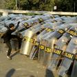 A protester attacks a police line during a demonstration in Jakarta