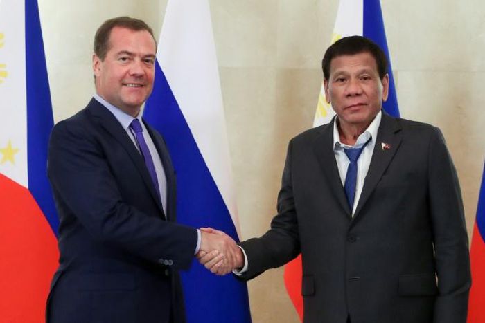 A spokesman for Philippine leader Rodrigo Duterte (right) defended his dishevelled appearance at a meeting with Russian Prime Minister Dmitry Medvedev (left) in Moscow