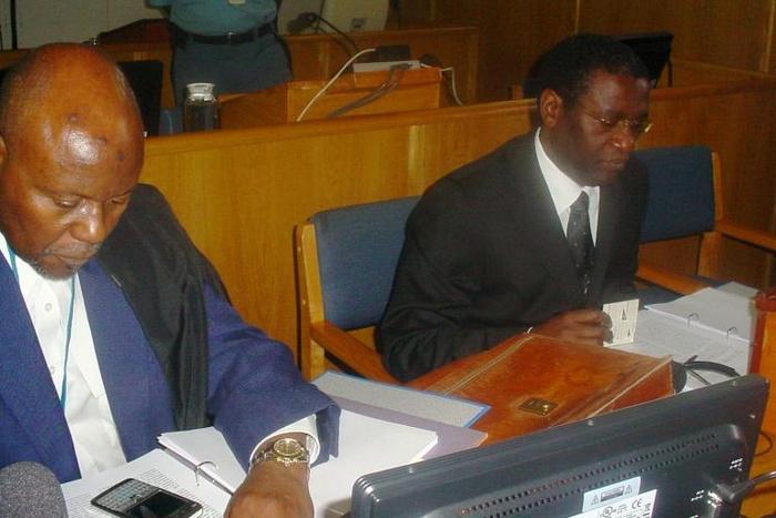 Ngirabatware, right, seated next to his lawyer at the start of his trial in 2008