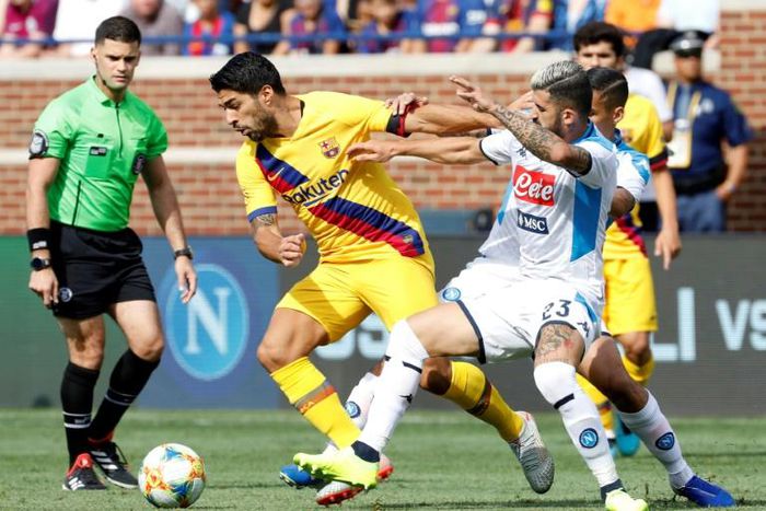 Luis Suarez, center, scored two goals to help spark Barcelona over Napoli 4-0 on Saturday at Ann Arbor, Michigan
