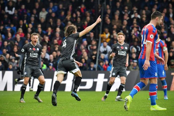 Turkish delight: Caglar Soyuncu (centre) celebrates opening the scoring for Leicester against Crystal Palace
