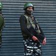 Indian paramilitary troopers stand guard during a lockdown in Srinagar