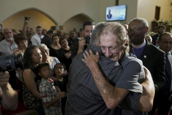 Antonio Basco greets well-wishers at the public memorial for his wife, Margie Reckard, a victim of the El Paso shooting