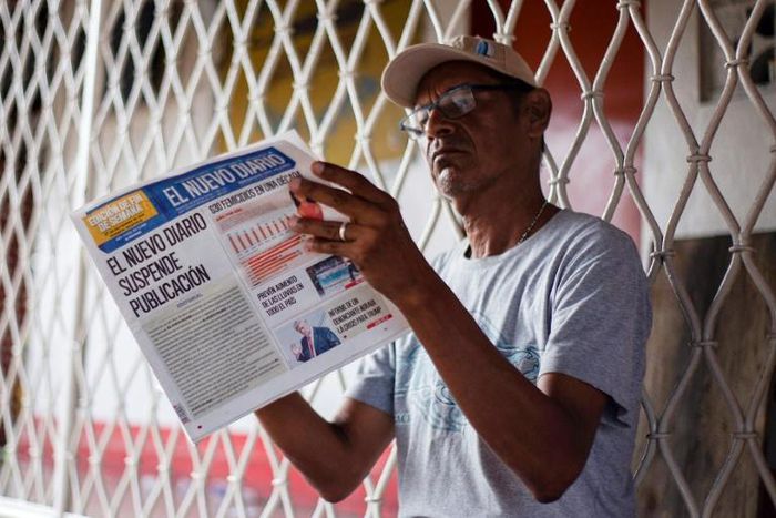 A man reads the last edition of 'El Nuevo Diario' newspaper in Managua on September 27, 2019