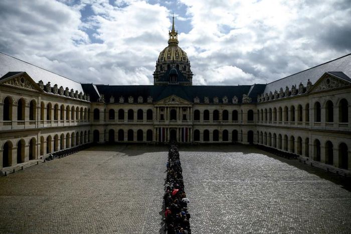 A massive queue snaked around the Invalides complex to pay homage at Jacques Chirac's coffin ahead of a national day of mourning on Monday