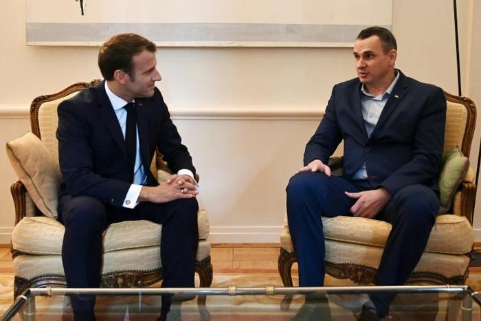 French President Emmanuel Macron (left) meets Ukrainian film director Oleg Sentsov, released last month by Russia in a prisoner swap with Kiev