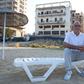 Pavlos Iacovou sits near the ghost town of Varosha, fenced off by occupying Turkish soldiers in 1974