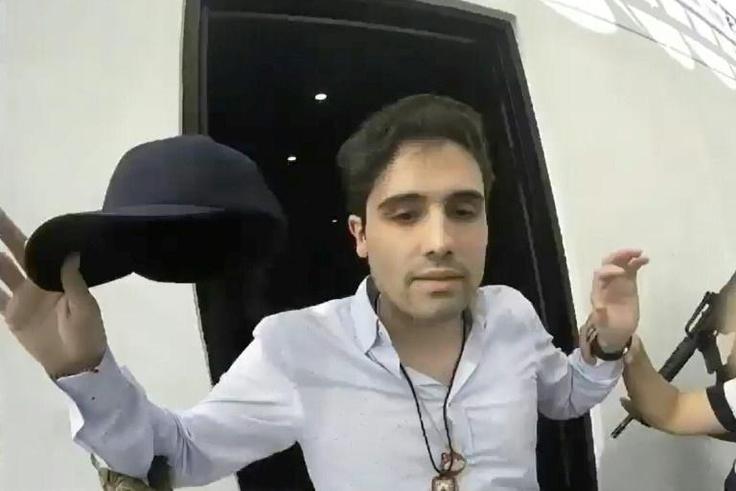 A screenshot of a handout video released by the Mexican government on October 30, 2019 shows the moment alleged trafficker Ovidio Guzman, son of jailed drug kingpin Joaquin "Chapo" Guzman was arrested October 17, 2019