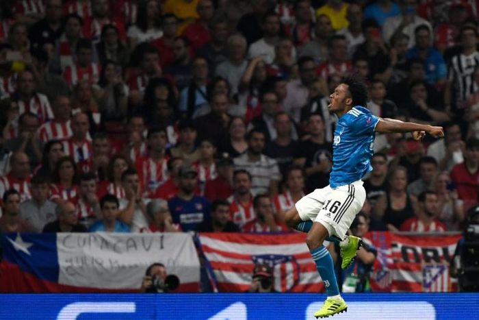 Juventus' Juan Cuadrado celebrates after scoring in the Champions League against Atletico Madrid on September 18, 2019.