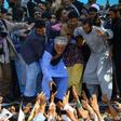 Afghan presidential candidate Abdullah Abdullah (C) claimed victory just two days after the September 28 election and before all votes had even arrived in Kabul for counting