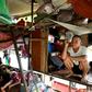 Vietnamese migrant workers living on Hanoi's Red River rise before dawn to buy fruit wholesale before heading to a market