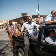 Plainclothes police patrol the Johannesburg township of Alexandra after the unrest