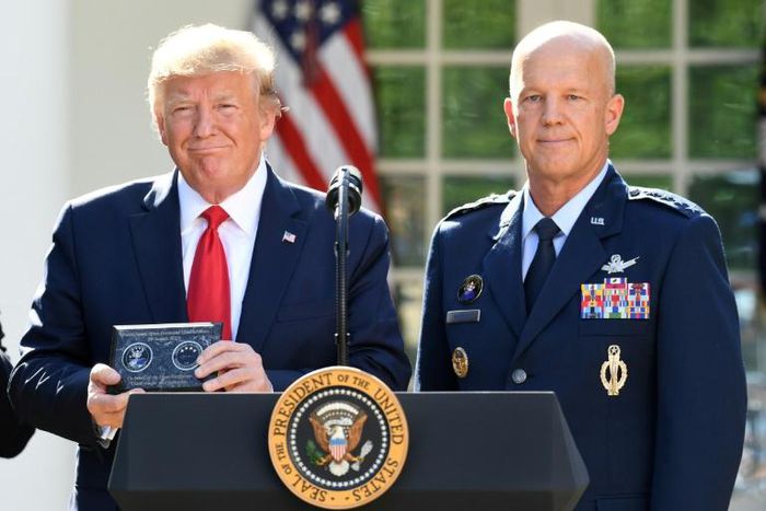 US President Donald Trump (L) with General John Raymond, who will lead the Pentagon's new Space Command