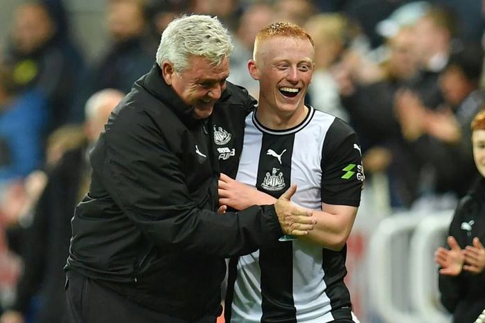 Newcastle manager Steve Bruce congratulates Matty Longstaff after the win against Manchester United