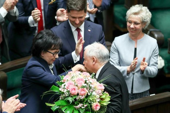 Poland's new parliament speaker Elzbieta Witek (L) is congratulated by Jaroslaw Kaczynski, leader of the governing right-wing Law and Justice (PiS) party