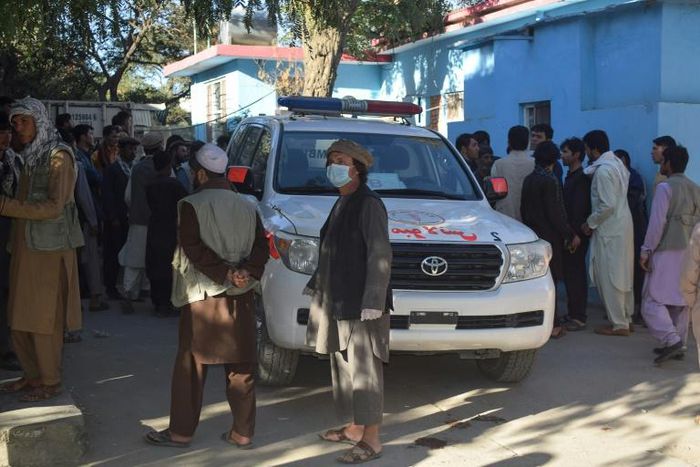 Afghans wait outside a hospital in Kabul for news of friends and family injured in a Taliban attack