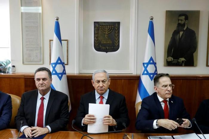 Flanked by cabinet members, Israeli Prime Minister Benjamin Netanyahu warns Palestinian militant group Islamic Jihad it will have to "absorb more and more blows" if it keeps up its rocket fire into Israel