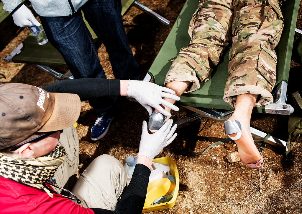 <strong>FIELD HOSPITAL:</strong> Marchers use the medical tents along the course for shade as much as for first aid. The most prevelant condition among marchers: blisters.