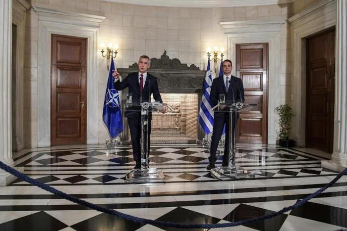 NATO's General Secretary Jens Stoltenberg (L) speaks next to Greek Prime Minister Kyriakos Mitsotakis during a press conference after their meeting in Athens on October 10, 2019