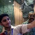 A Pakistan student in Karachi takes a selfie in front of the statue of Indian pilot Wing Commander Abhinandan Varthaman who was shot down over Kashmir earlier this year