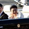 Japan’s Emperor Naruhito  and Empress Masako wave during their royal parade in Tokyo