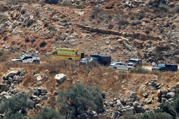 Israeli ambulance crews and security forces deploy to the scene of a bomb attack near the Israeli settlement of Dolev in the occupied West Bank on August 23, 2019