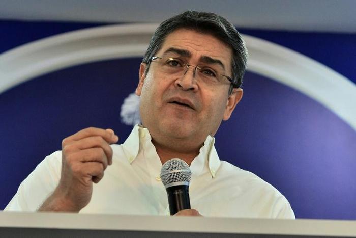 Honduran President Juan Orlando Hernandez gives a message to the nation at the presidential palace in Tegucigalpa on October 3, 2019 denying he took millions of dollars in bribes from drug lords