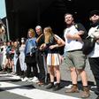 Climate change protesters attempting to blockade a mining conference linked arms in front of mounted police in Melbourne before clashes started