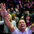 Followers participate in a religious service at the Manantial de Bendiciones Evangelical church in San Martin, Buenos Aires province