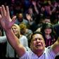 Followers participate in a religious service at the Manantial de Bendiciones Evangelical church in San Martin, Buenos Aires province