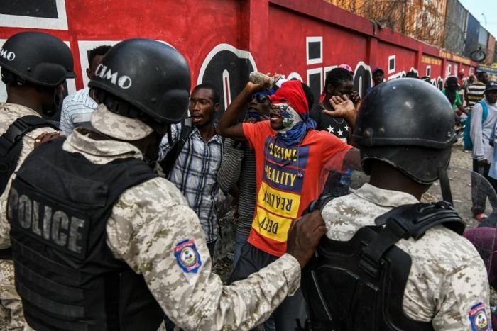 Protesters demanding the resignation of Haitian President Jovenel Moise face off with police in Port-au-Prince on October 4, 2019, as public anger simmers