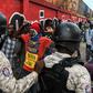Protesters demanding the resignation of Haitian President Jovenel Moise face off with police in Port-au-Prince on October 4, 2019, as public anger simmers