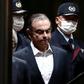 Nissan's former CEO Carlos Ghosn will pay $1 million in fines to settle with US securities regulators over what they said was a fraud related to his expected retirement income