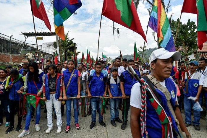 Indigenous people walk through Toribio, Cauca department, Colombia, to attend the National Meeting of Indigenous Guards