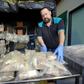 Queensland police officer arranges packets containing drugs after authorities seized 766 kilograms (1,670 pounds) of the "highest purity" MDMA recorded in Queensland state