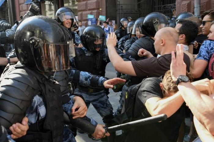 A Russian court sentenced a protester to three years in prison for attacking a policeman during recent anti-government demonstrations