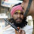 For decades Hindus and Muslims have been bitterly divided over the 16th-century Babri mosque - here a sadhu, a Hindu holy man, is stopped from entering the disputed site in March 2002