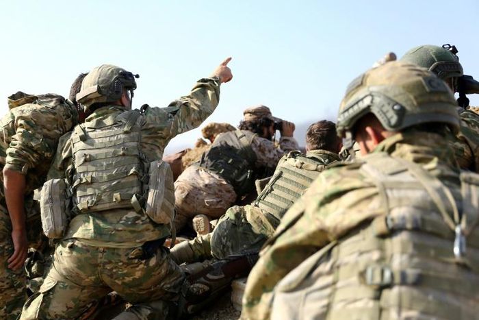 Turkish troops and their Syrian allies step up their offensive against Kurdish forces, thrusting into the key border town of Ras al-Ain