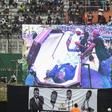 DJ Arafat's coffin was placed at the centre of the football pitch
