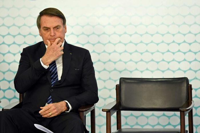 (FILES) In this file photo taken on September 06, 2019, Brazilian President Jair Bolsonaro gestures during the launching ceremony of the new student ID at Planalto Palace in Brasilia