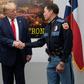 US President Donald Trump shakes hands with El Paso Police Chief Greg Allen (R) before greeting first responders in the wake of the massacre of 22 people at a local Walmart