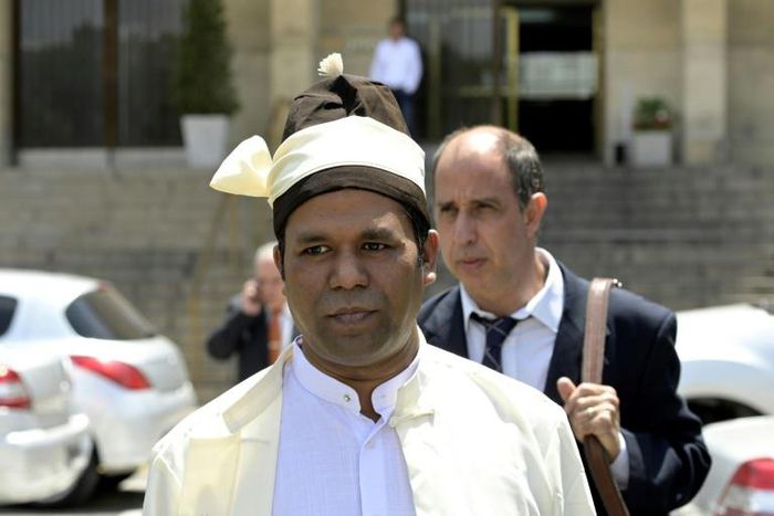 The president of The Burmese Rohingya Organisation UK (BROUK), Tun Khin (L) and Argentine human rights lawyer Tomas Ojea in Buenos Aires after filing a lawsuit naming former democracy icon Aung San Suu Kyi and others over crimes against Rohingya