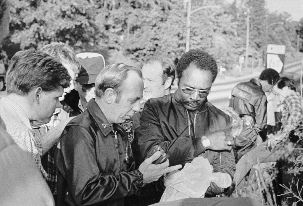 Police examine evidence found at the crime scene where 17-year-old William Barretts body was found.