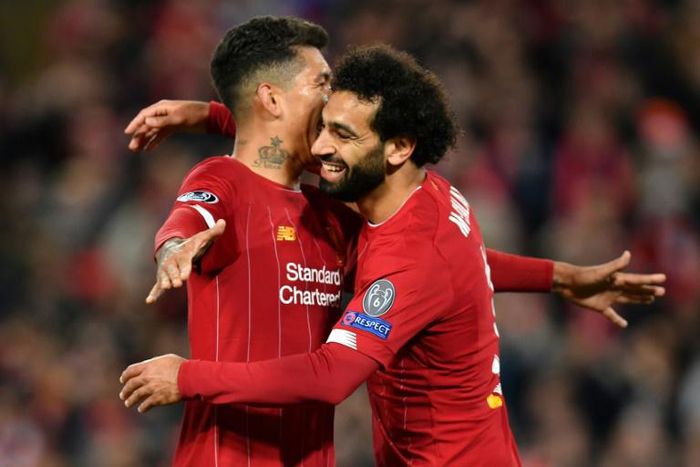 Mo Salah celebrates with Roberto Firmino after scoring in Liverpool's Champions League win over Salzburg on Wednesday